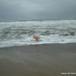 Cold feet for a nude blonde winter bather. Barefoot At The Beach