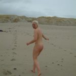 Cold feet for a nude blonde winter bather. Barefoot At The Beach